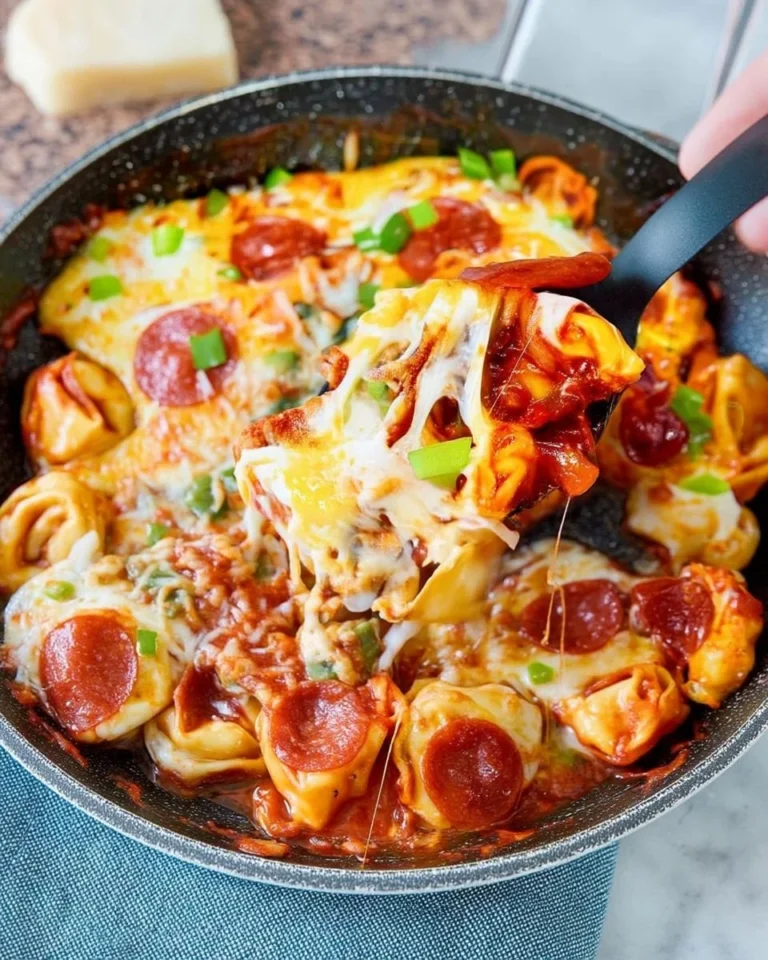 Cheesy Pizza Tortellini Skillet Casserole in a rustic dish