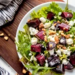 Colorful Beet and Goat Cheese Salad with arugula and walnuts