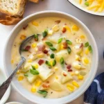 Bowl of creamy Corn Potato Chowder with fresh ingredients