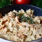Creamy Chicken Garlic Parmesan Pasta in a bowl garnished with parsley.
