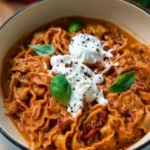 Plate of delicious Sun-Dried Tomato Pasta topped with fresh herbs