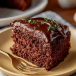Delicious Coca-Cola Chocolate Cake topped with chocolate icing and sprinkles