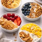 Delicious yogurt granola bowls topped with fresh fruits and nuts