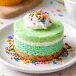 Delicious no bake cheesecake topped with fresh berries on a serving plate