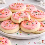 Plate of soft frosted sugar cookies with colorful icing decorations