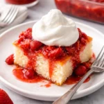 Delicious Strawberry Shortcake topped with whipped cream and fresh strawberries