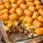 Delicious and cheesy Tater Tot Casserole with golden crunchy tots