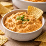 Cheesy Crock Pot Buffalo Chicken Dip in a serving dish