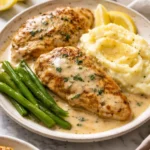 Plate of Chicken in White Wine Sauce garnished with herbs