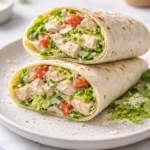 Chopped Chicken Caesar Salad Wraps served on a plate with fresh ingredients.