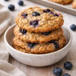 Delicious classic blueberry oatmeal cookies with blueberries and oats on a plate.