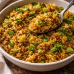 Bowl of easy Mediterranean lentils and rice garnished with fresh herbs