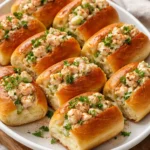 Delicious mini shrimp rolls served on a platter, perfect for appetizers.