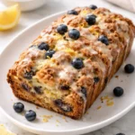 Freshly baked Sourdough Blueberry Lemon Bread with blueberries and lemon zest.