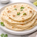 Homemade sourdough tortillas on a wooden table