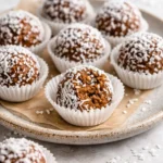Healthy carrot cake energy balls made with oats, nuts, and spices.