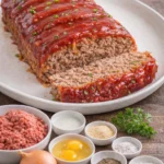 Classic meatloaf served with mashed potatoes and vegetables