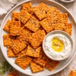 Crunchy red lentil crackers ideal for healthy snacking and pairing with dips.