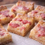 Delicious rhubarb custard bars served on a rustic plate