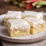 Delicious rhubarb custard bars with cream cheese frosting on top