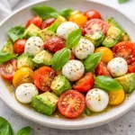 Caprese Avocado Salad with tomatoes, mozzarella, basil, and avocado slices