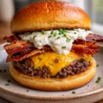 Loaded ranch bacon cheeseburger with fresh ingredients and toppings