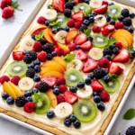 Colorful and vibrant fruit pizza topped with fresh fruits on a crust