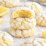 Freshly baked Lemon Crinkle Cookies with a crinkled texture and bright lemon flavor.