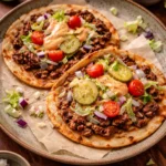 Smash Burger Tacos with special sauce served on a plate