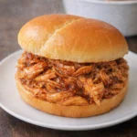 Delicious Crockpot BBQ chicken served with sides for a satisfying meal