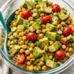 Chickpea salad with honey lemon garlic vinaigrette in a vibrant bowl